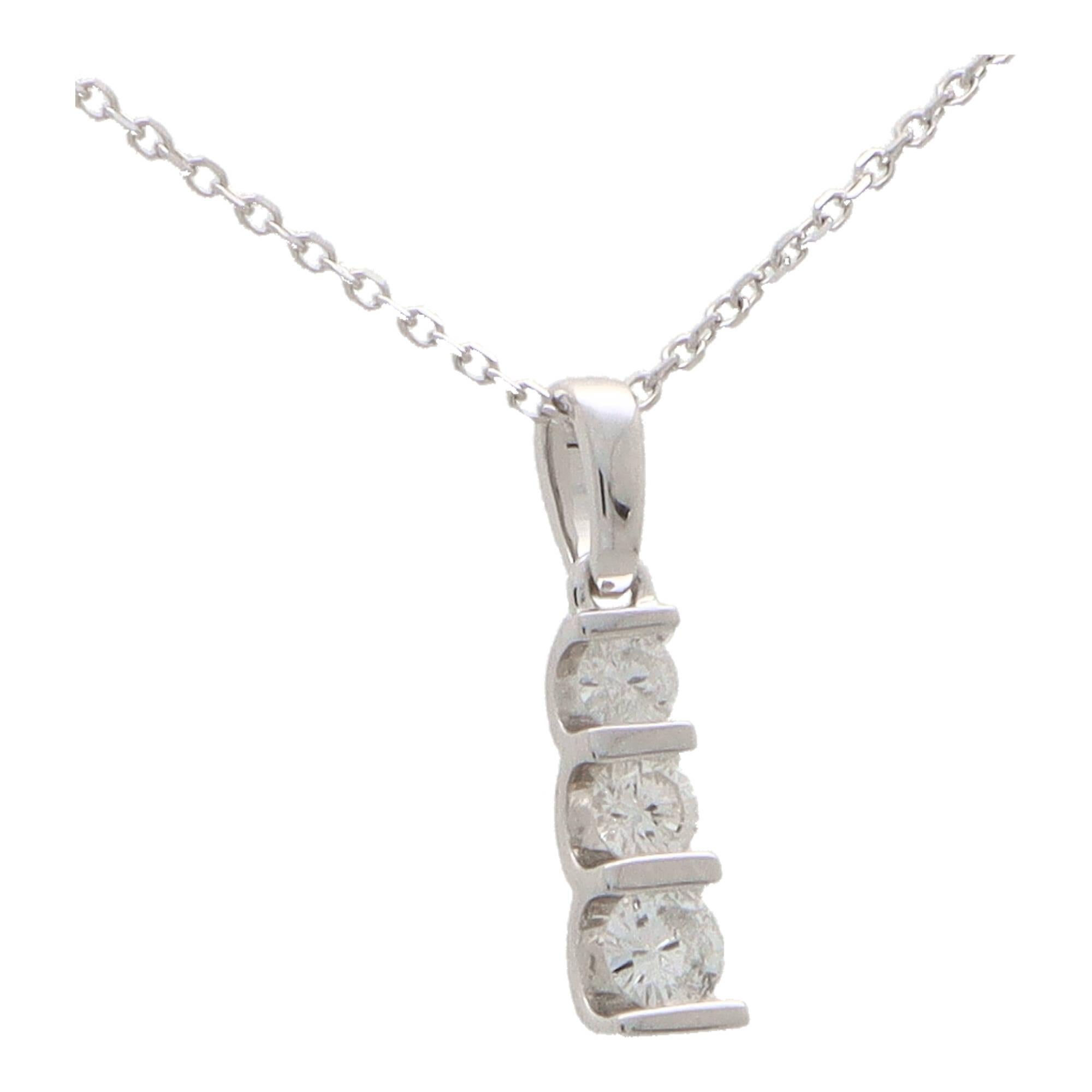 A stylish contemporary diamond pendant set in 14k white gold.

The pendant is set with three graduating diamonds that are all securely rub over set in a white gold setting. The pendant hangs from a 16-inch fine white gold trace chain.

Due to the