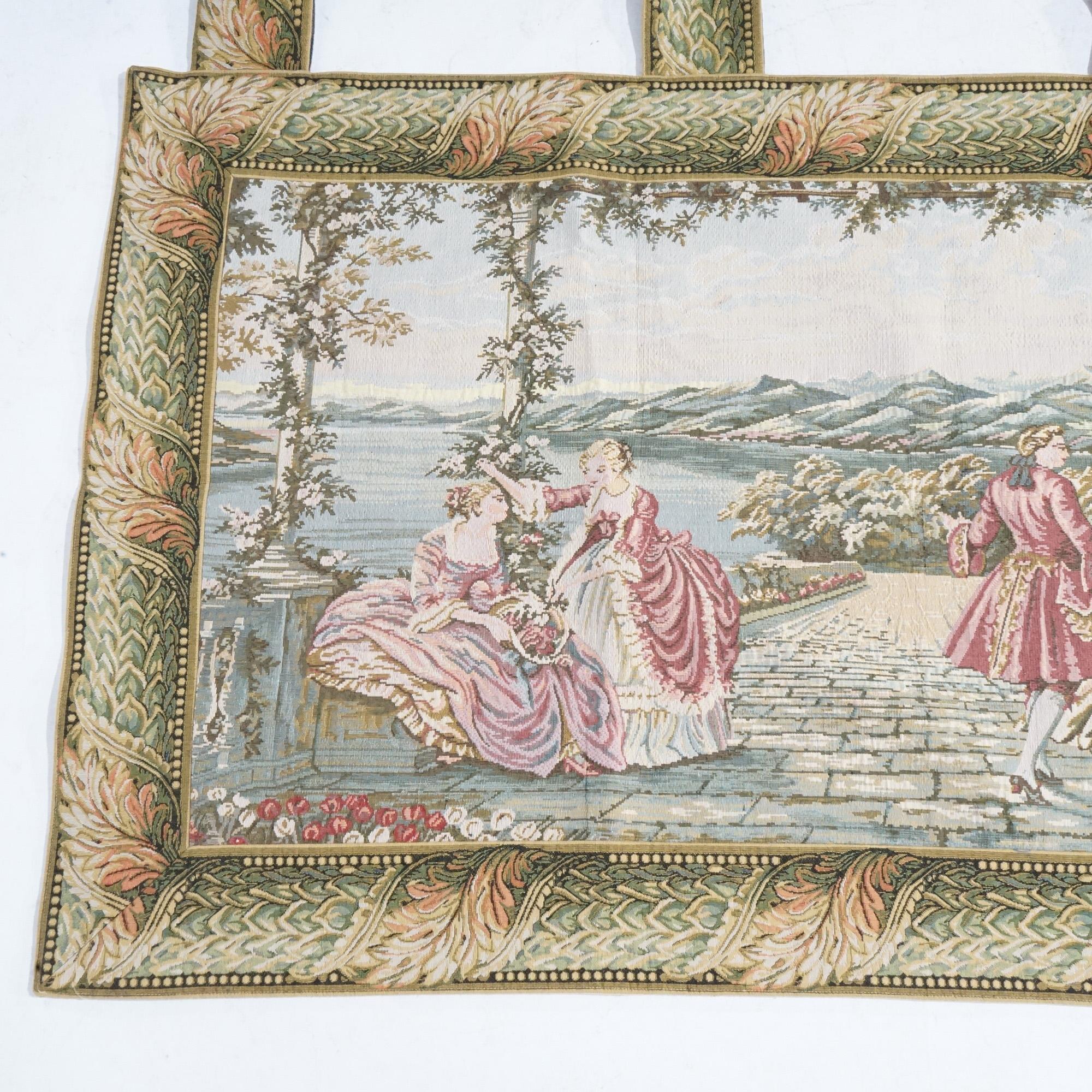 Tapisserie murale contemporaine gréco-romaine à cour scénique avec personnages et paysage lacustre montagneux, 20e siècle.

Dimensions : 40,25''H x 82,25''L x .5''D.