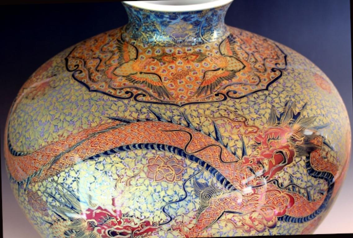 Mesmerizing large contemporary Japanese decorative porcelain vase, extremely intricately hand painted in green, orange and gold, a breathtaking masterpiece by highly acclaimed master porcelain artist of the Imari-Arita region of Japan and recipient