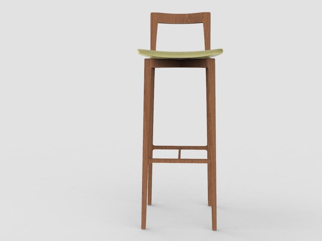 Contemporary Grey Bar Chair in Linea 631 Green Leather & Smoked Oak by Collector Studio

With a light solid wood structure, this bar chair is suitable for contemporary interiors, the bar chair’s proportions and reduction of material provides