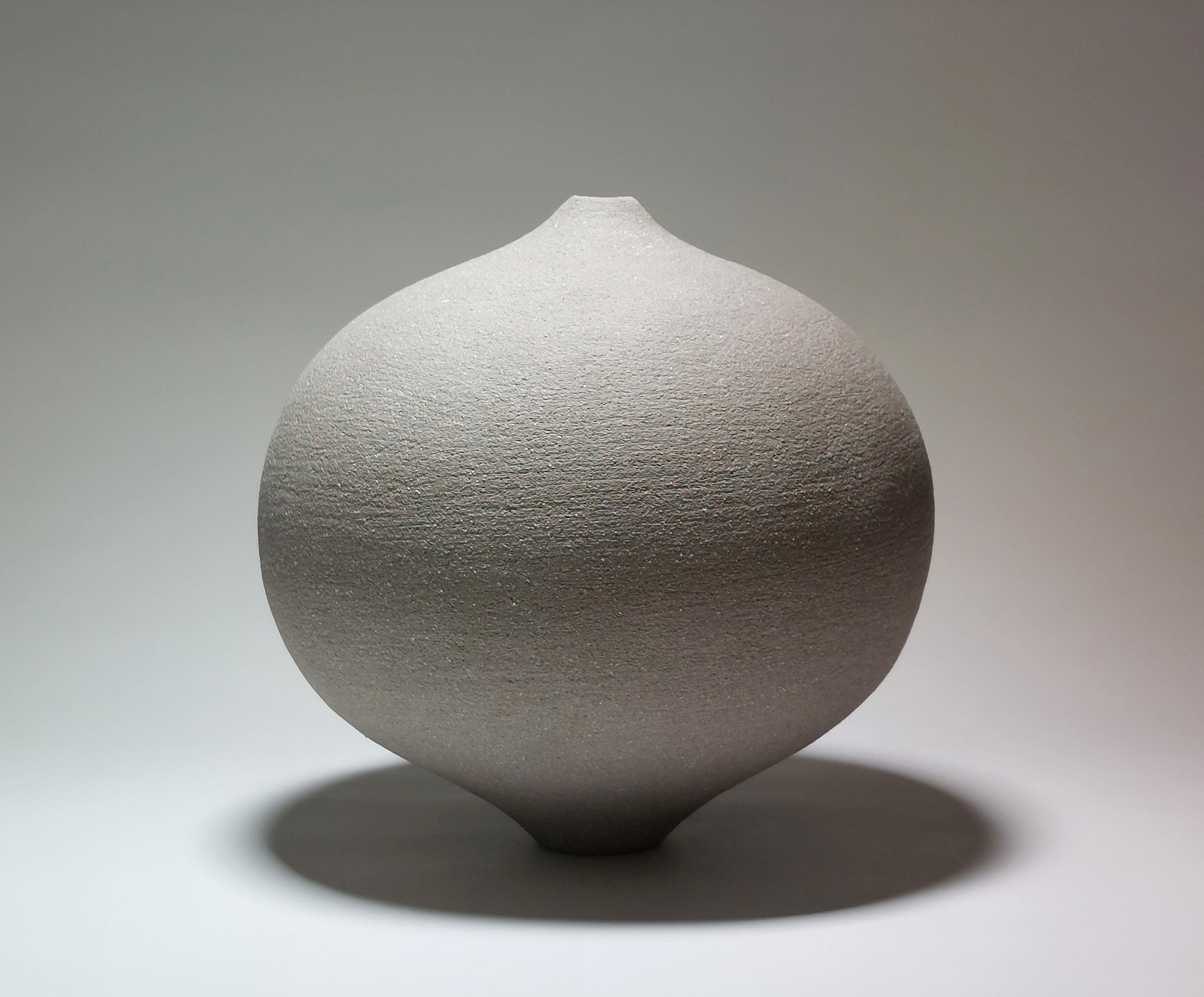 Contemporary Grey Stoneware Ceramic Vessel by Rachel Peters, Medium, In Stock.

This vessel has been hand built from Rokk Grey Stoneware Clay using the traditional method of coiling.   Refined and finished by hand to create a beautiful tactile