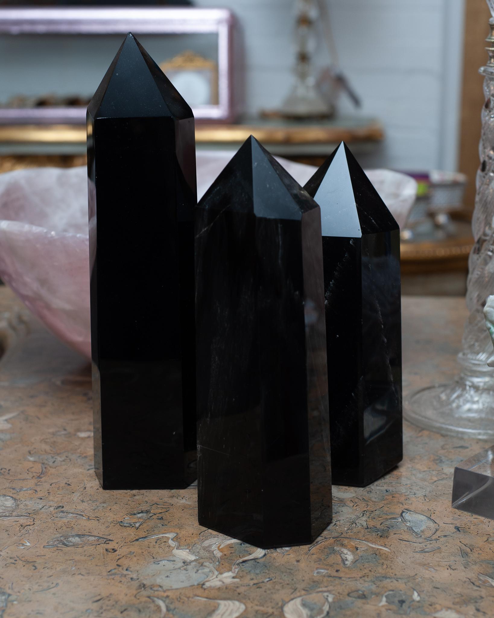 Invite healing energy into your home with a contemporary group large black obsidian crystal points / obelisks. Obelisks are symbols of protection, defence and stability. Crystal points are often used to direct energies through the apex of a point.