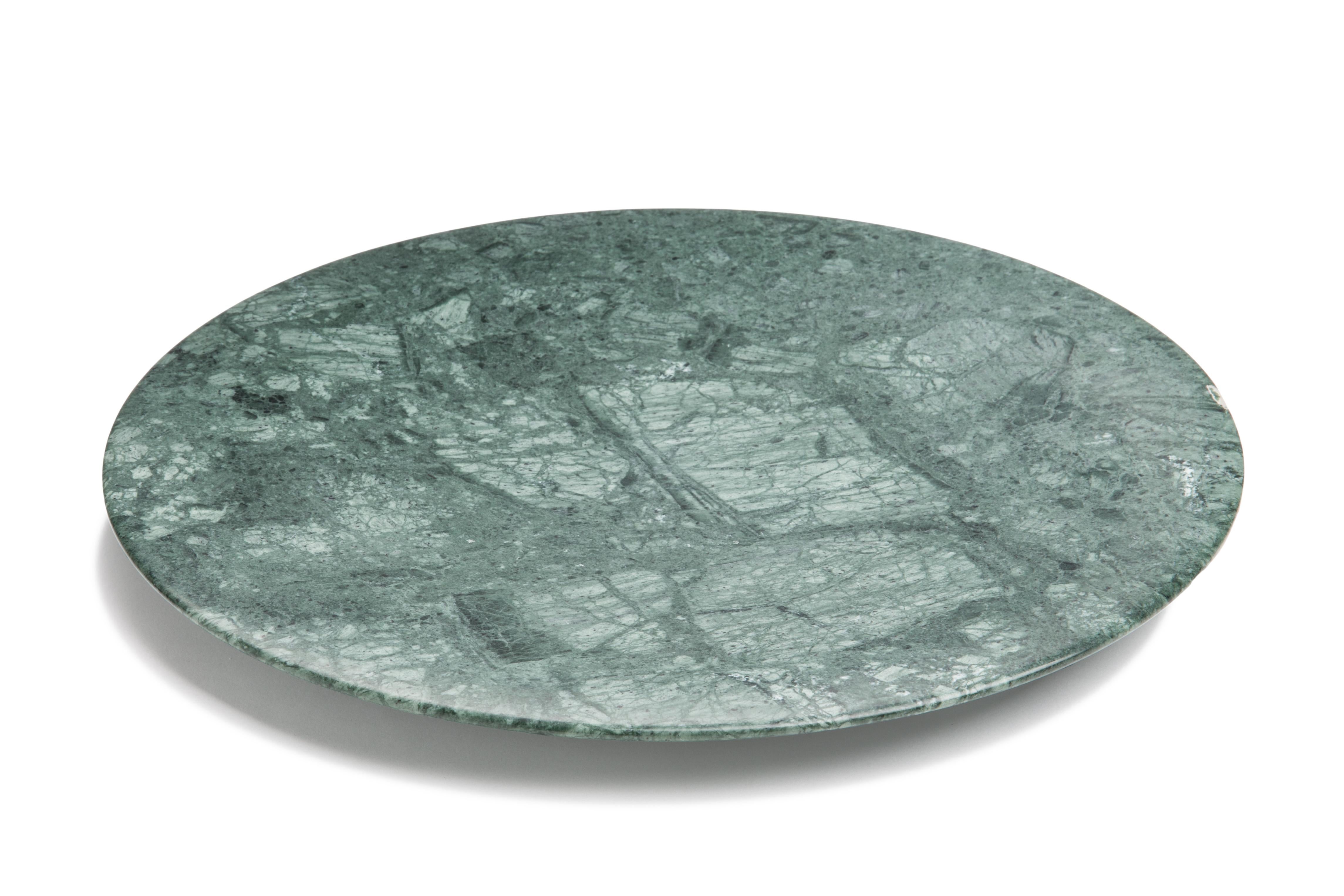 This stunning tray, made from Guatemala green marble, evokes the Renaissance concept of man being at the centre of space and nature with its circular shape. The circle is rich in symbolism in European history and art. The fusion of these two
