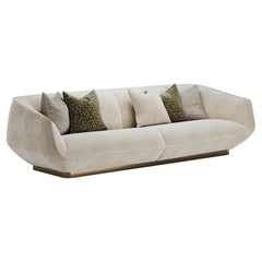 Contemporary Gulman Sofa with Sleek Curved Silhouette And Brushed Brass Base