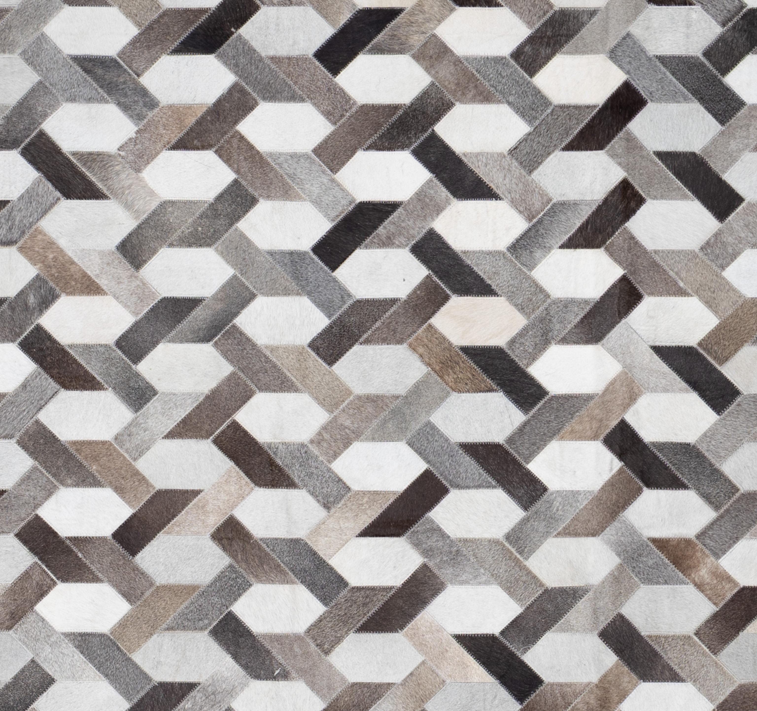 This Contemporary hair-on-hide rug blends natural texture with modern design, creating a striking and sophisticated statement piece. Crafted from genuine cowhide, this rug showcases unique variations in color, pattern, and texture—no two pieces are