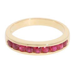 Contemporary Half Eternity Ruby Channel Ring in Yellow Gold