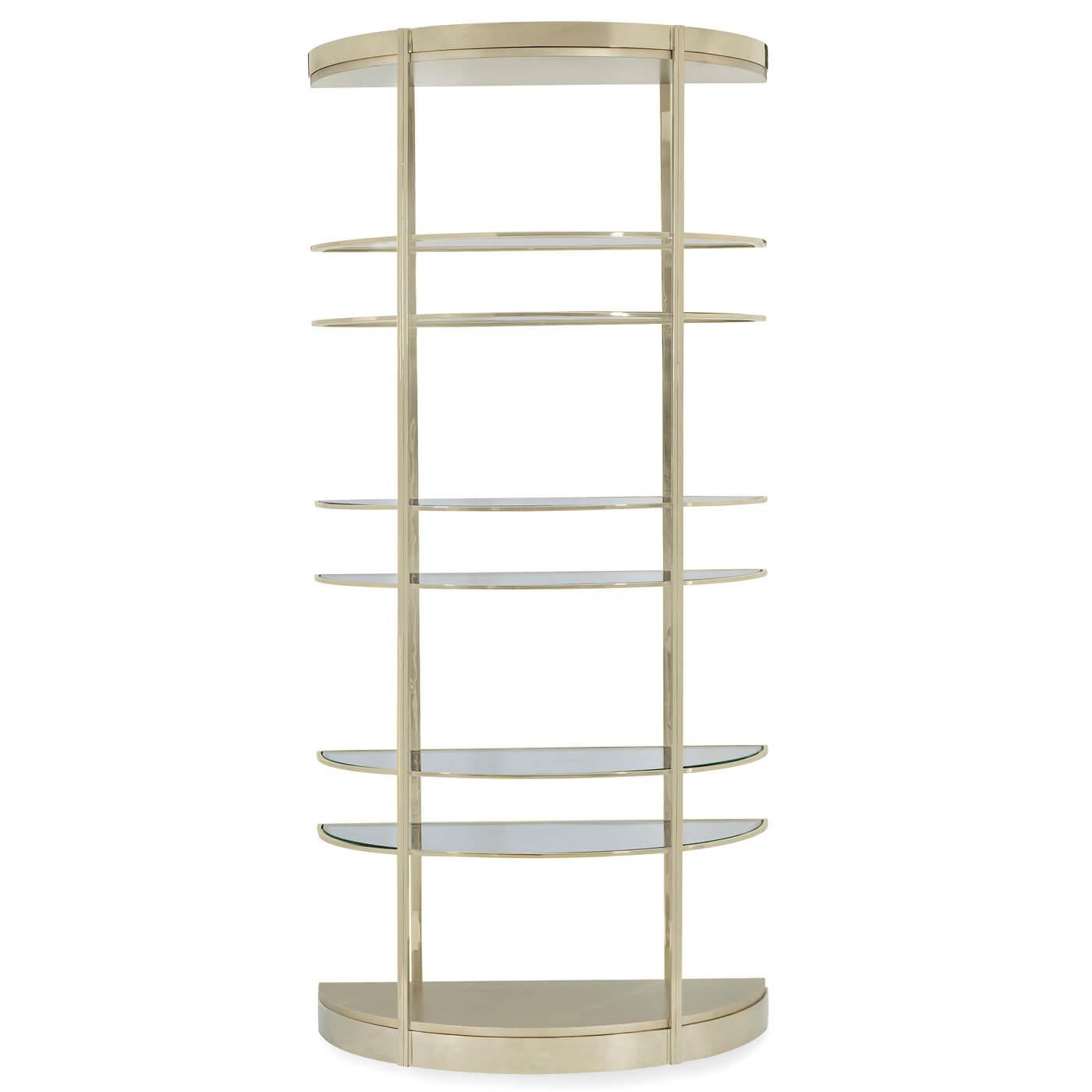 A contemporary-style half-moon etagere with a light and airy design. The tall frame has been given a high polished gold finish and surrounds each of the six semi-circular glass shelves. 

Dimensions
39