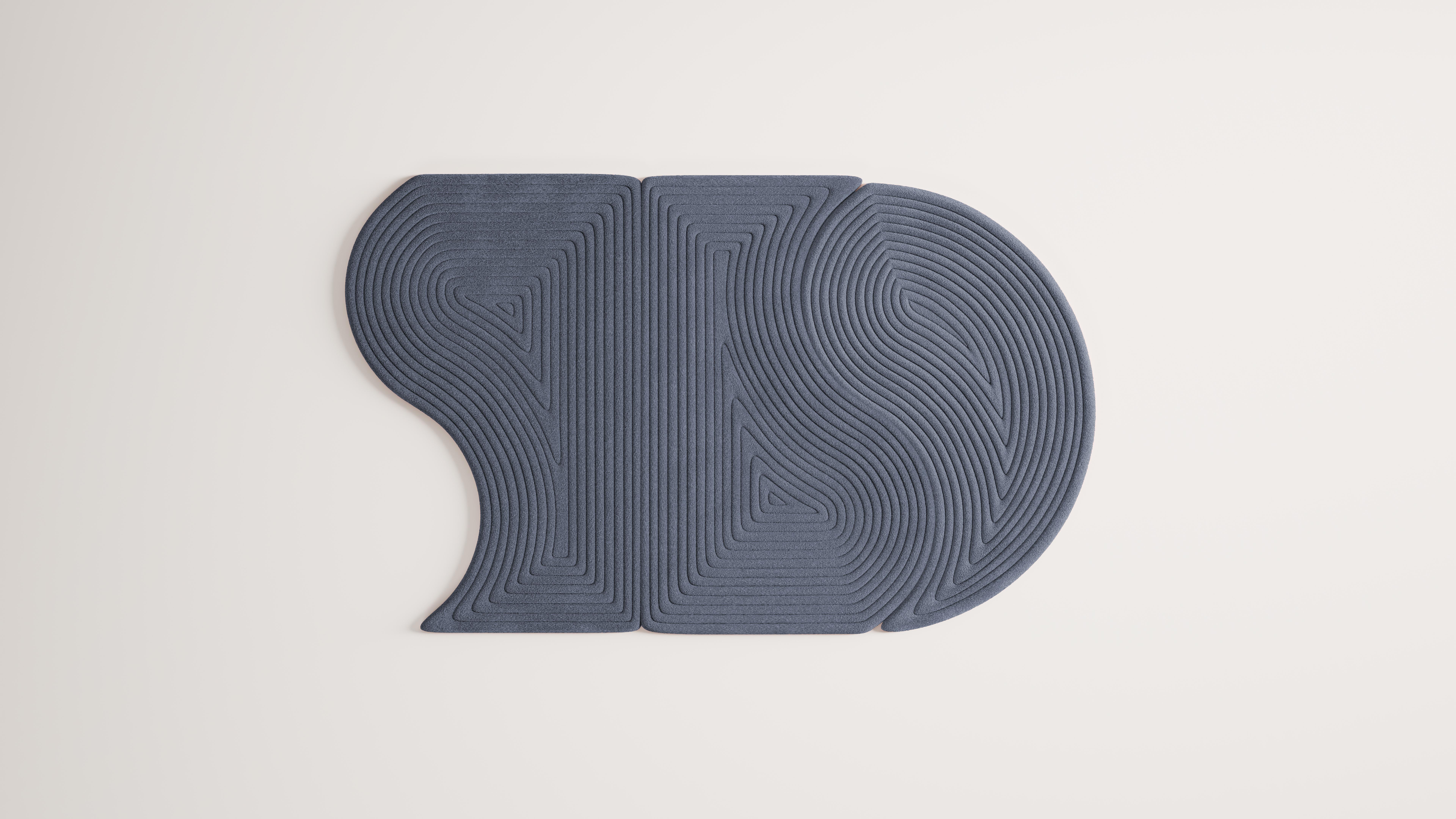 Niwa is a collection of minimal and organic modular rugs. Each module can be combined with others in endless ways to create customizable configurations. 

This collection is a representation of the sand element within Zen Gardens. The rugs provide