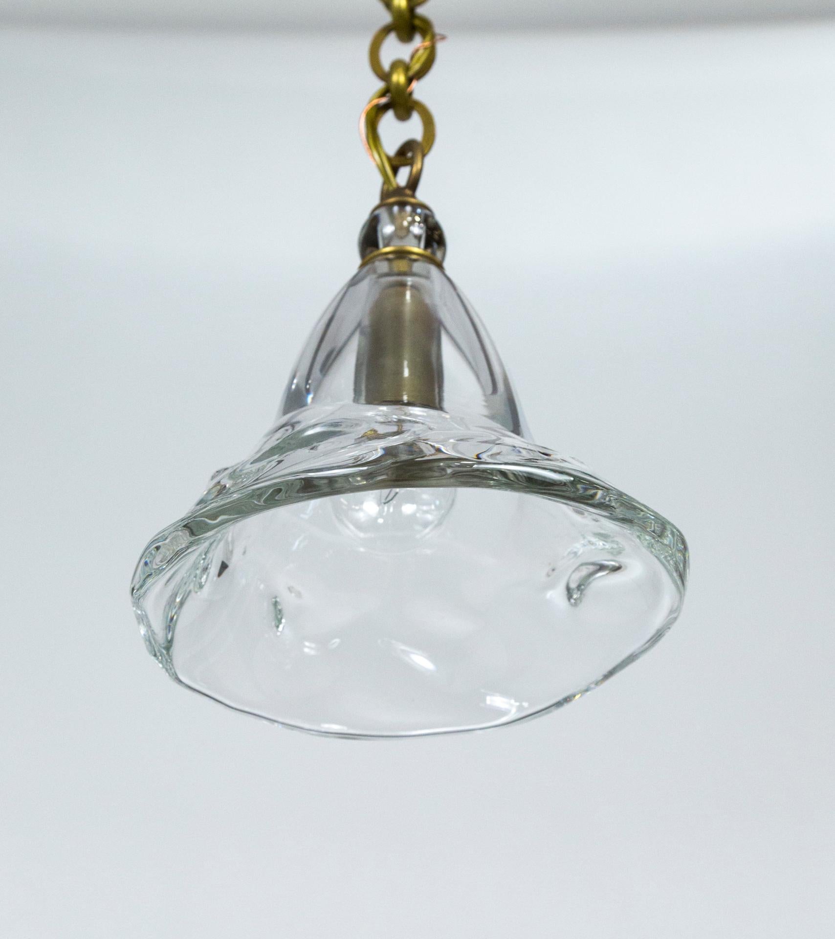 North American Contemporary Hand Blown Clear Bell Pendant Light on Long Brass Chain For Sale