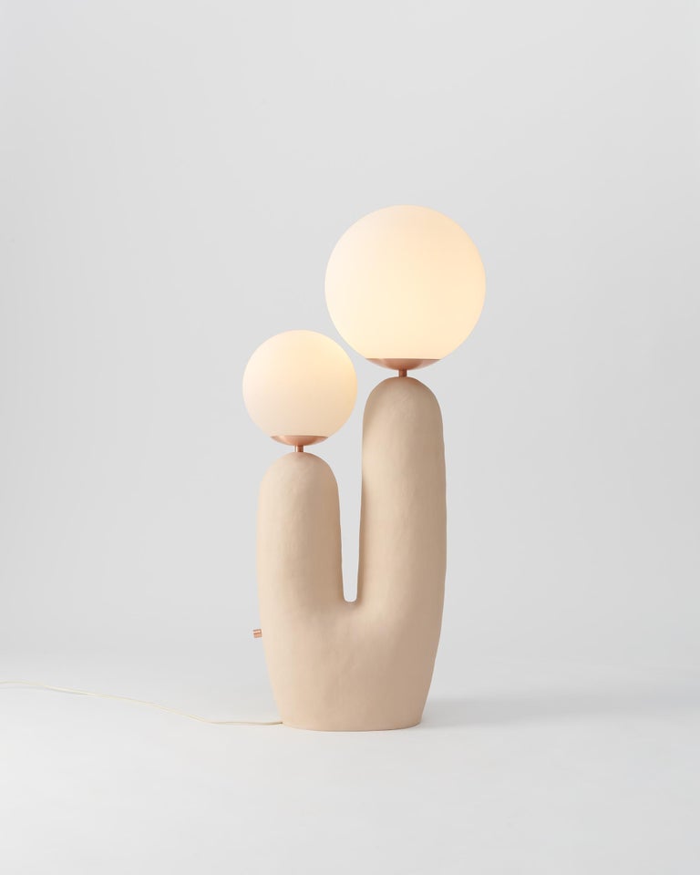 As part of the First Hand Collection, the Oo Lamps debuted at the International Contemporary Furniture Fair in 2018, where Best New Emerging Designer was awarded to Eny Lee Parker.
This ceramic base is hand-built, with copper detailing including a