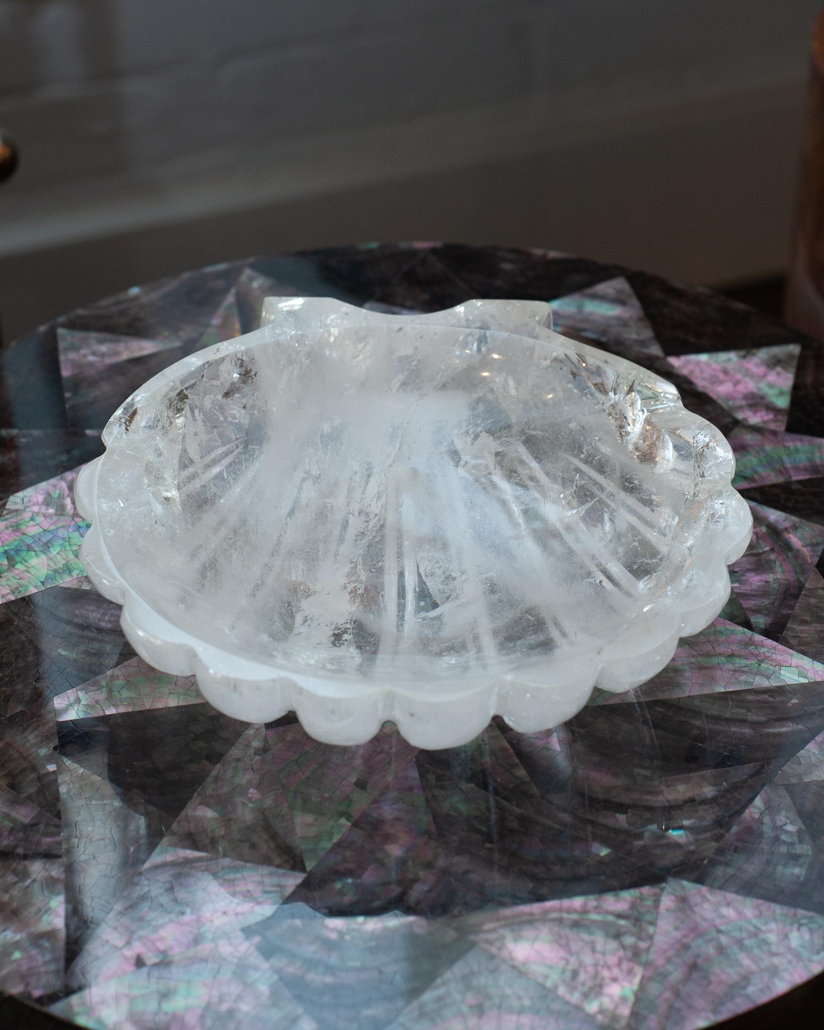 A beautiful hand carved shell tray in natural, clear rock crystal quartz. Finely carved from a super clear quality of rock crystal and polished to a brilliant high gloss finish. A stunning accessory for any tabletop. Hand carved in Minas Gerais,