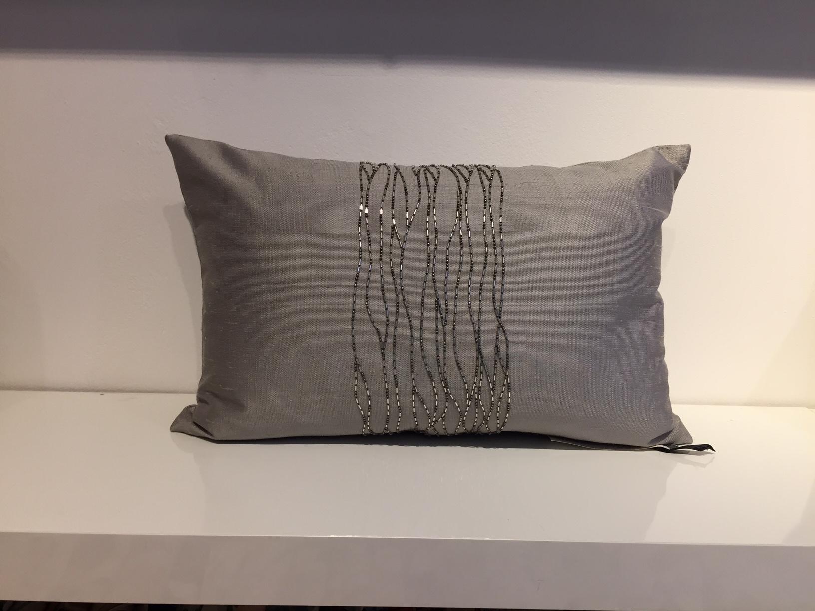 One set of cushions, 2 piece, size: 30 x 45cm,
Hand embroidery with silver beads, contemporary design on handwoven silk color light silver,
Cushion cover with cotton lining and concealed zipper in the bottom seam,
Inner pad with new feathers.