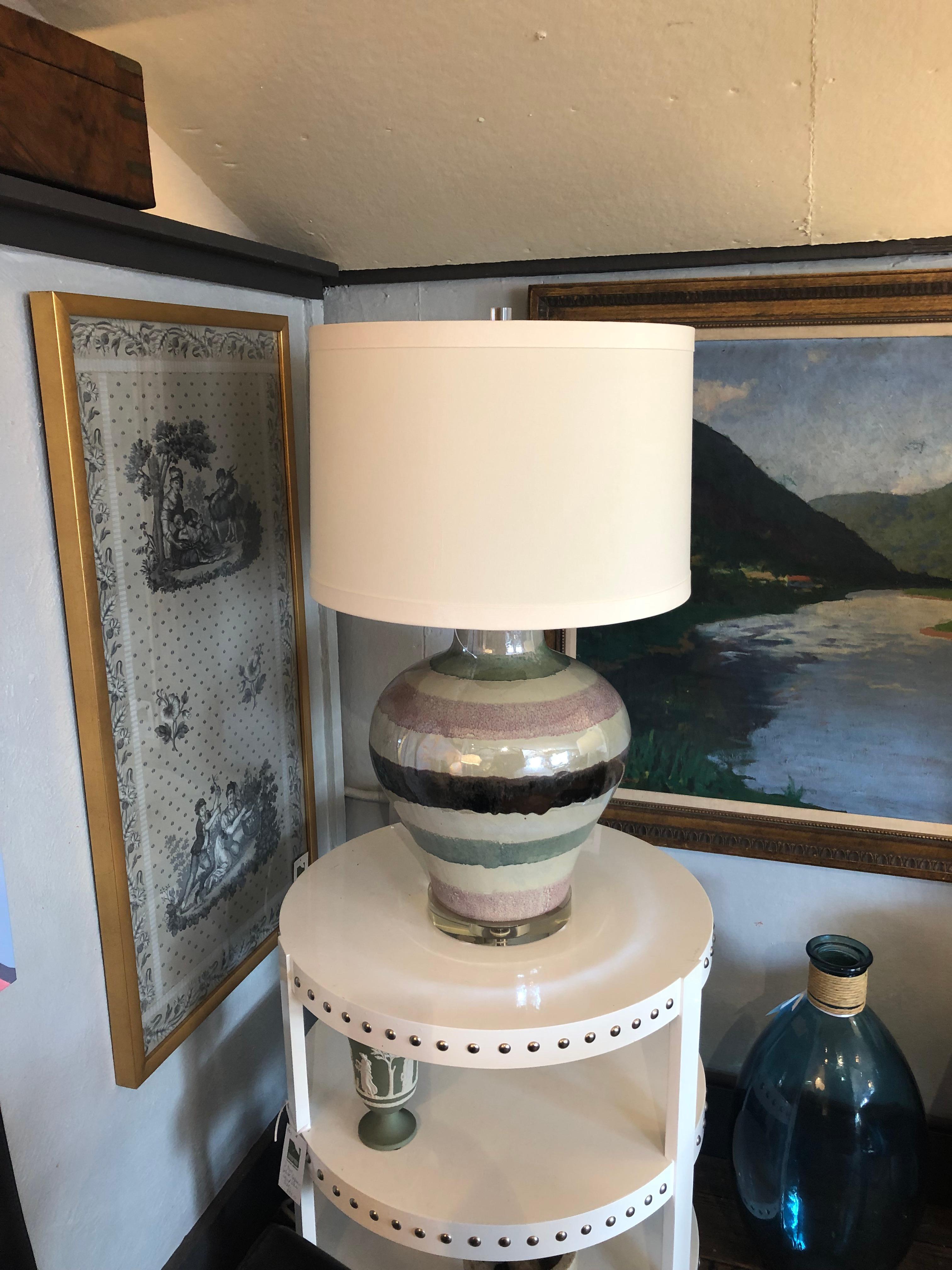 Stunning very large hand made artisan table lamp having glossy luscious glaze in horizontal stripes of taupe, celadon, mauve and brown.
32” H to lucite finial 15” diameter 
New $200 custom shade 