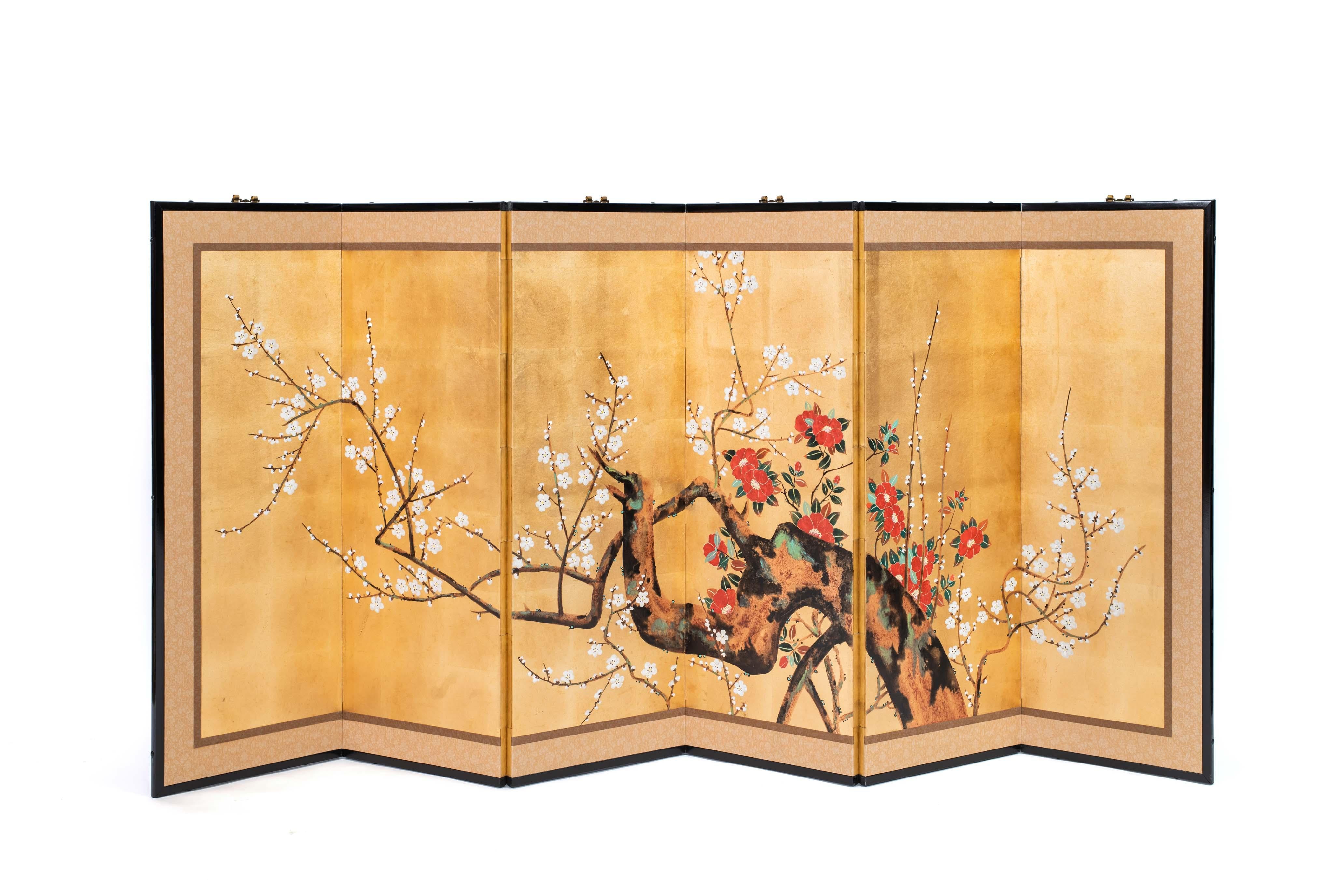 The red and white plum blossom painting of this six-panel screen is hand-painted in watercolor, on squares of gold leaf which are applied by hand to the paper base over carefully jointed wooden lattice frames. Lacquered wooden rails are then applied