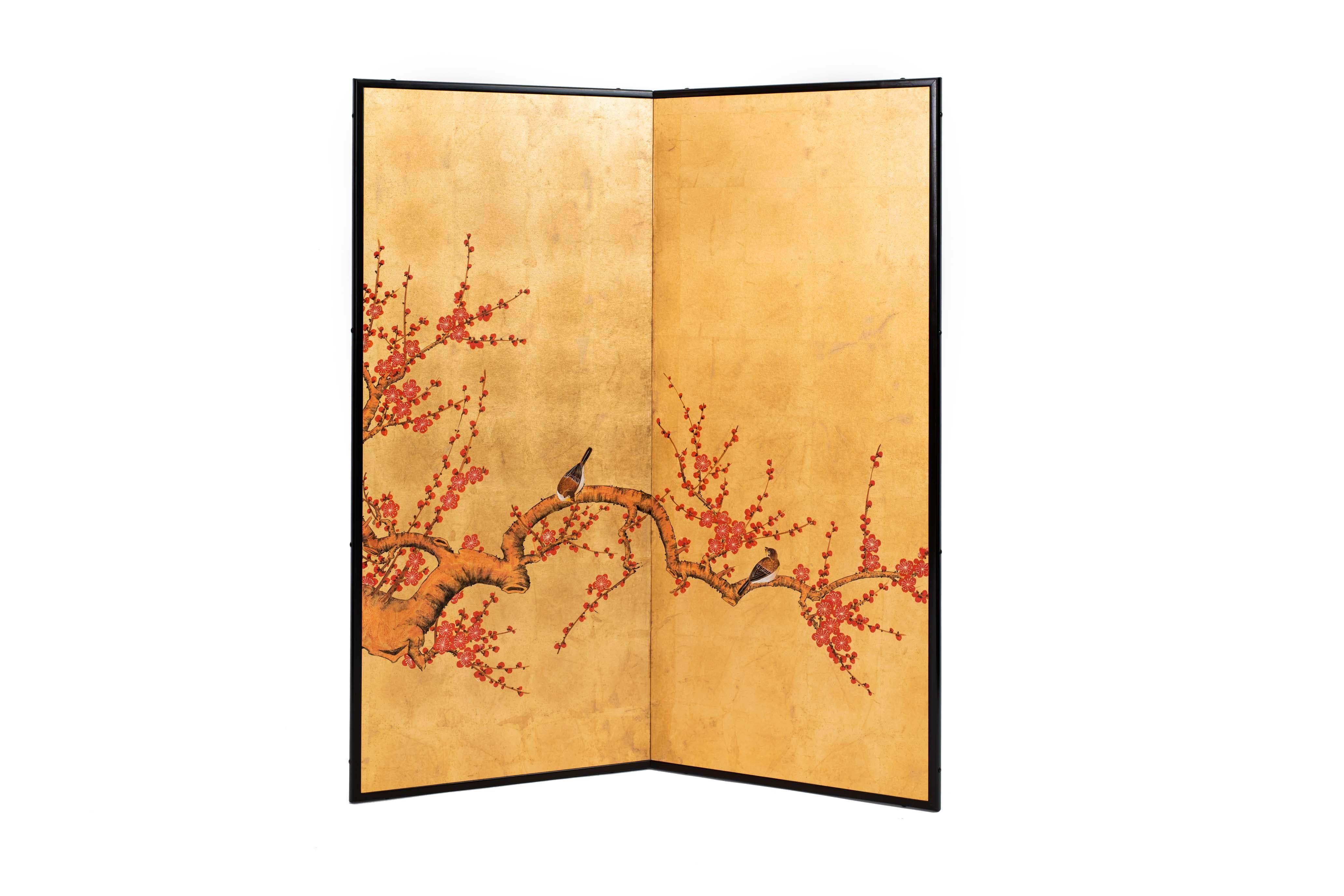 The red plum blossom and birds painting of this two-panel screen is hand-painted in watercolor, on squares of gold leaf which are applied by hand to the paper base over carefully jointed wooden lattice frames. Lacquered wooden rails are then applied