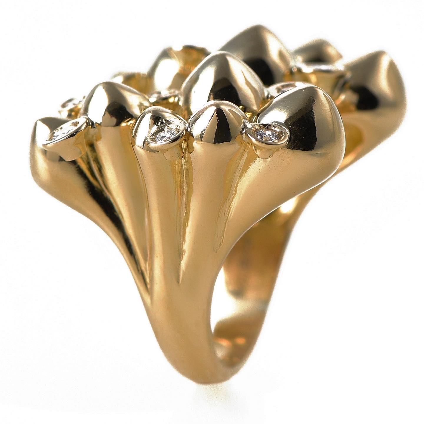 The ‘Spike cluster’, ring is masterfully hand sculpted and crafted in 18K yellow gold, hallmarked in Cyprus. This impressive and robust, open statement ring comes in a highly polished finish,  features 0,38 Ct. White V.S. Diamonds and makes the