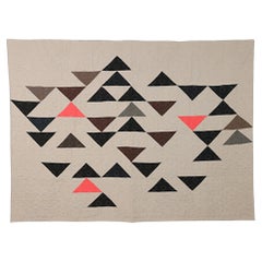 Contemporary hand-sewn Trianni quilt by British master maker
