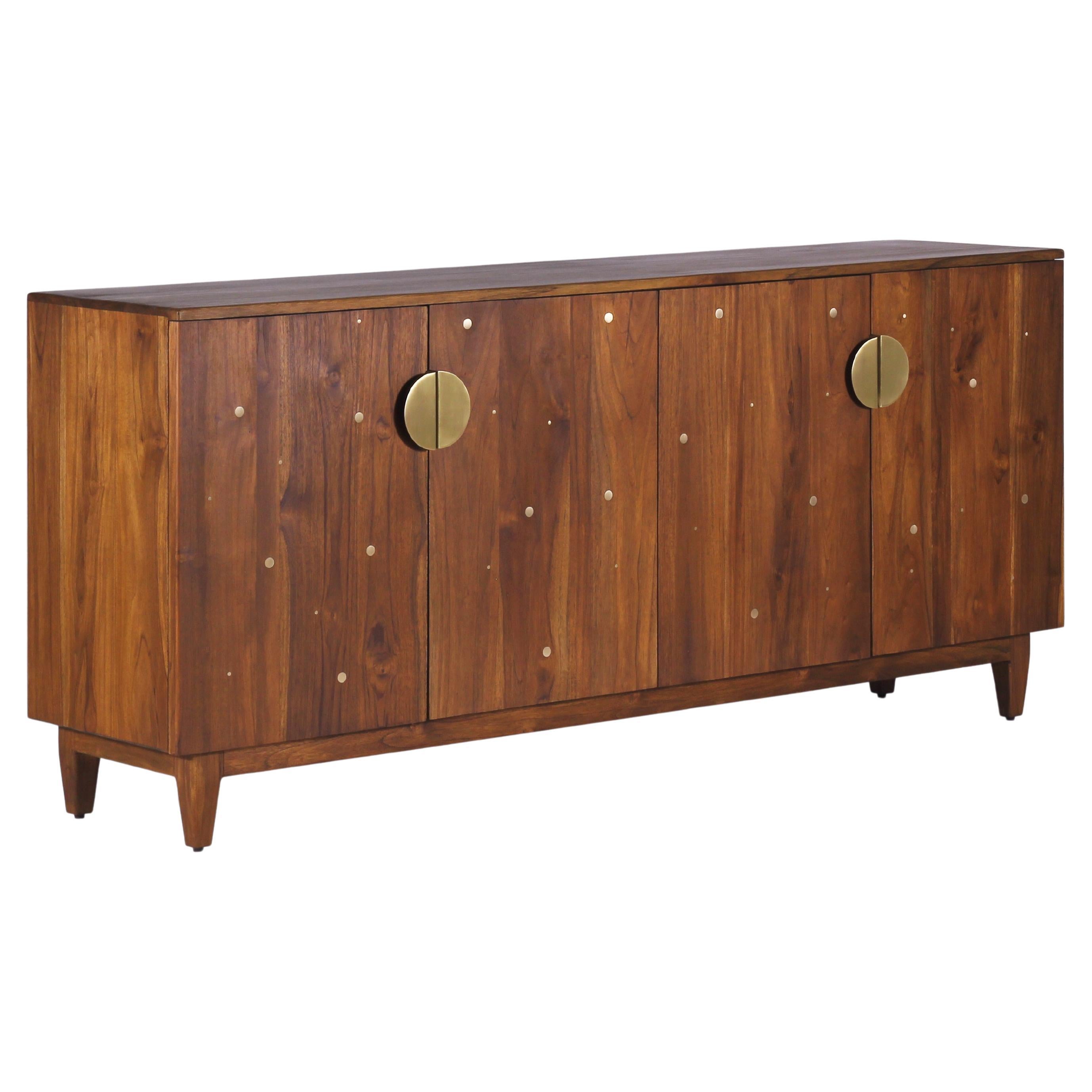 The Night Sky Credenza is a stunning storyteller created inspired by the timeless and delightful beauty in star-studded night skies. The credenza is constructed through joinery in solid oak. Its solid brass handles are handcrafted with care and