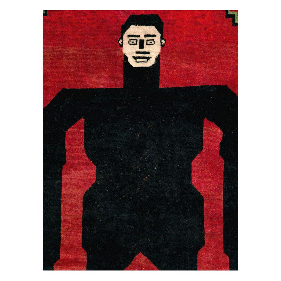A modern Afghan accent rug handmade during the 21st century with a pictorial depiction of the horror Classic character, Frankenstein.

Measures: 6' 8