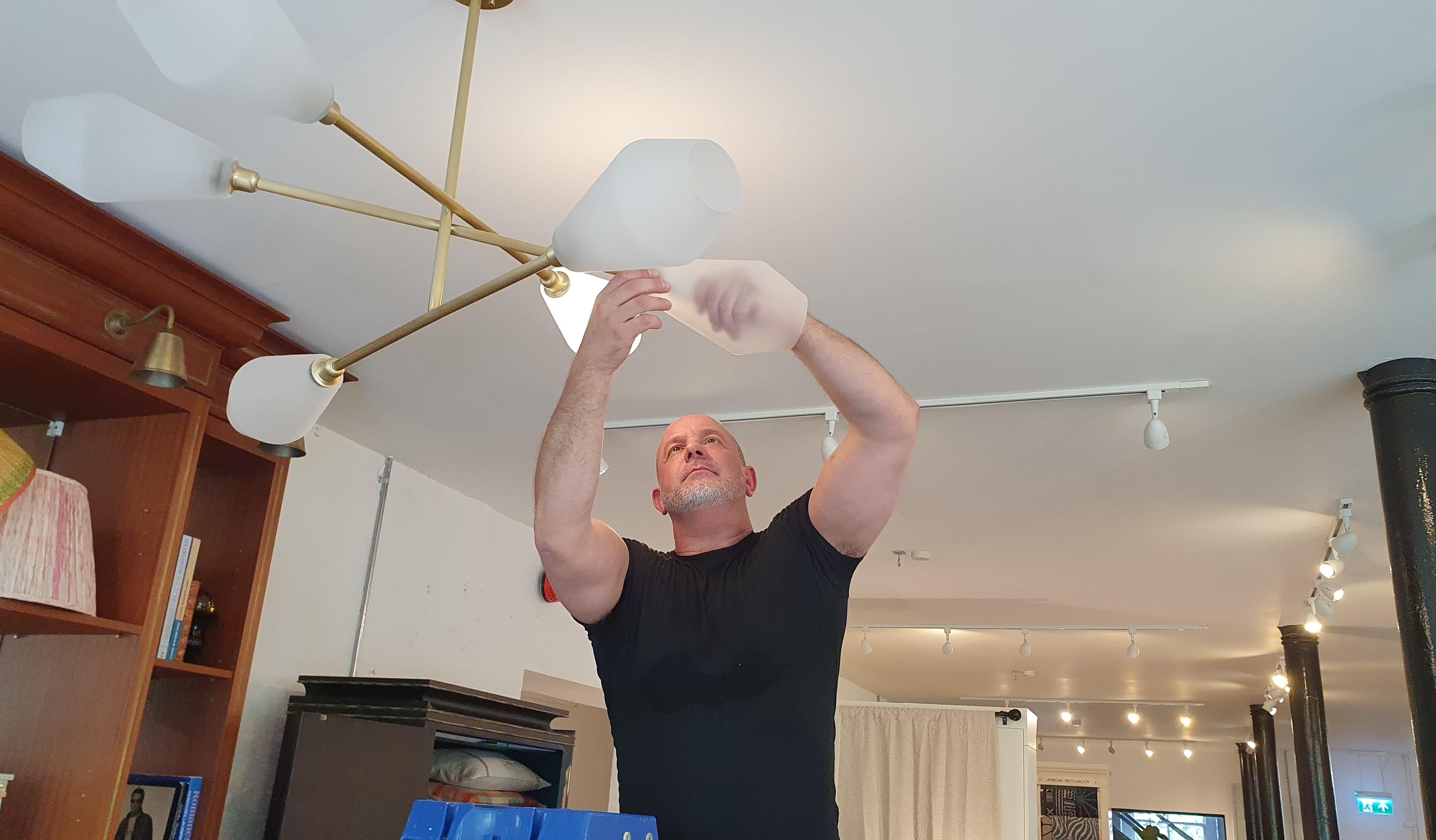 Contemporary handmade Brass chandelier with mouth blown frosted Glass shades For Sale 7