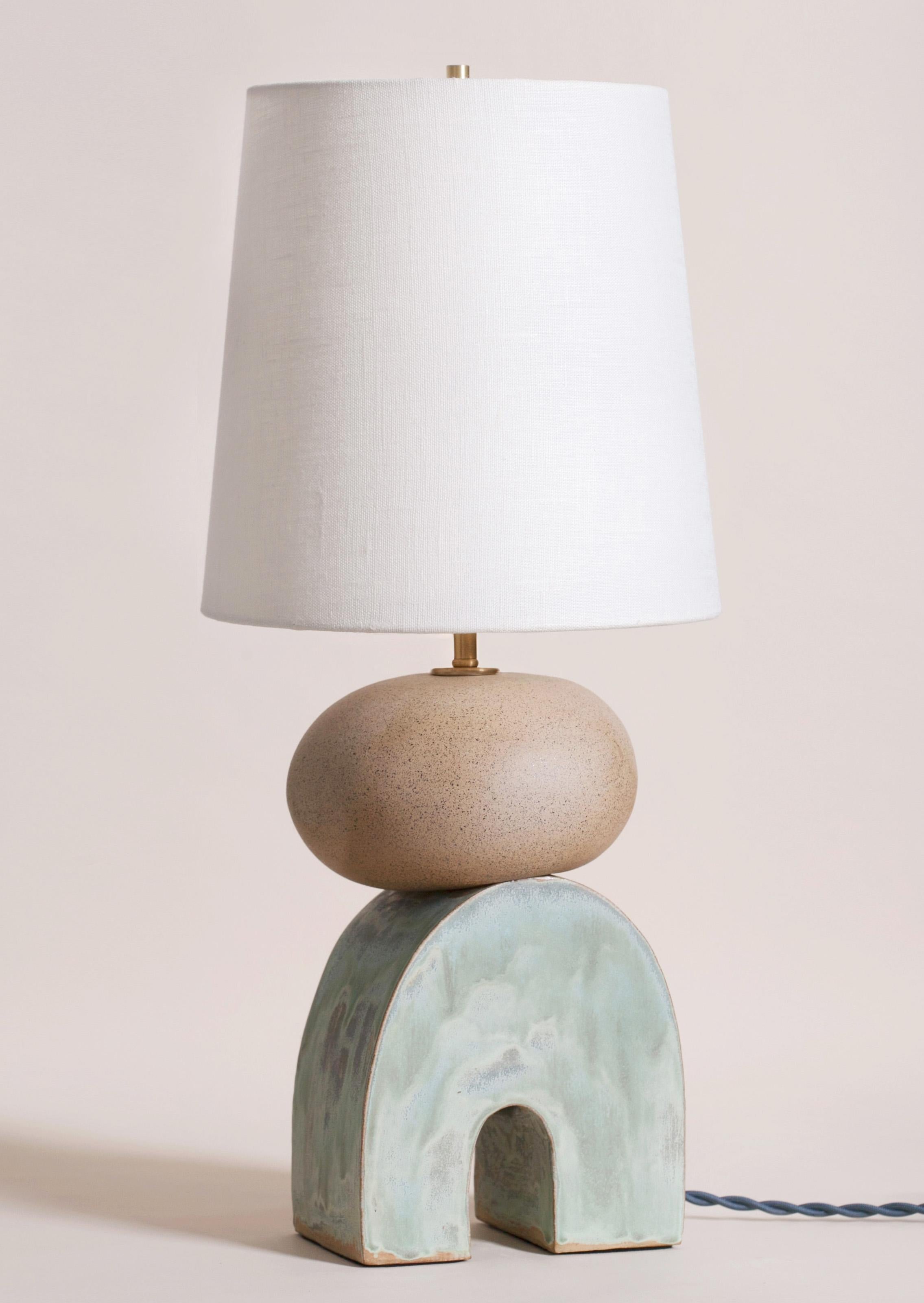 One of a kind ceramic lamp, thrown on the potters wheel and assembled by hand. The lamp base is comprised of two different clay bodies and features a raw, unglazed ceramic surface to highlight the texture of natural clay contrasted with a coppery