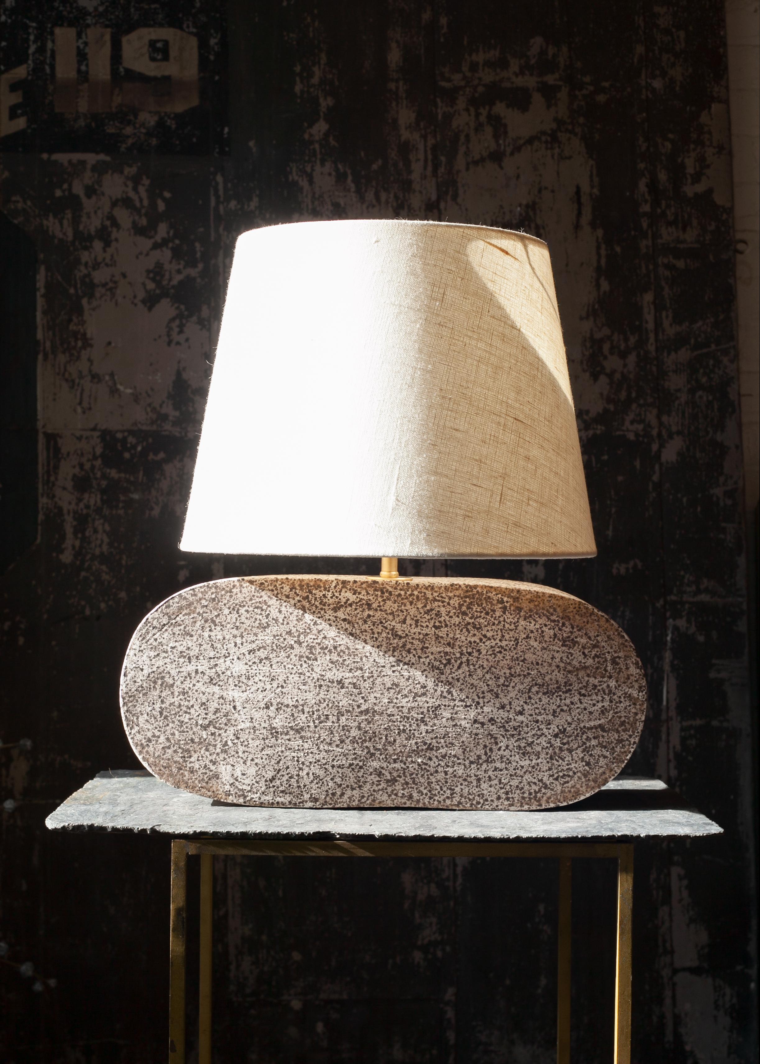One of a kind ceramic lamp, hand built and assembled by hand. The lamp base is made with speckled clay manufactured regionally to the East Coast with custom made matte finish white glaze. This piece was inspired by seashells and smooth stones