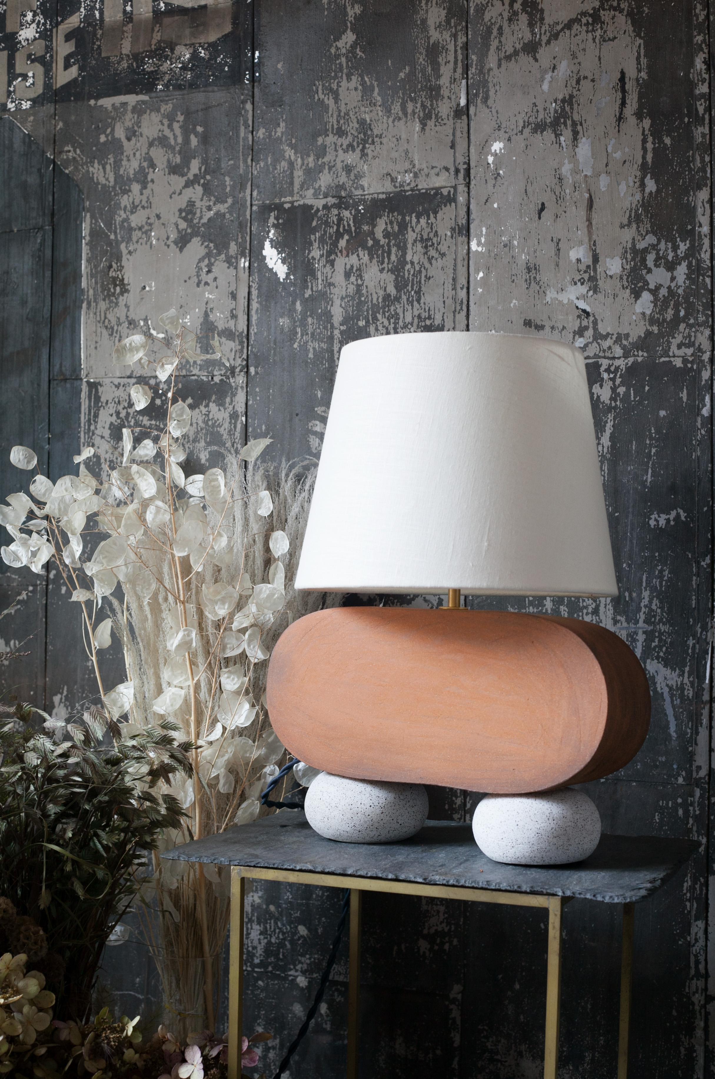 One of a kind ceramic lamp, hand built and assembled by hand. The lamp base is comprised of speckled clay manufactured regionally to the East Coast with custom made matte finish white glaze. This piece was inspired by seashells and smooth stones