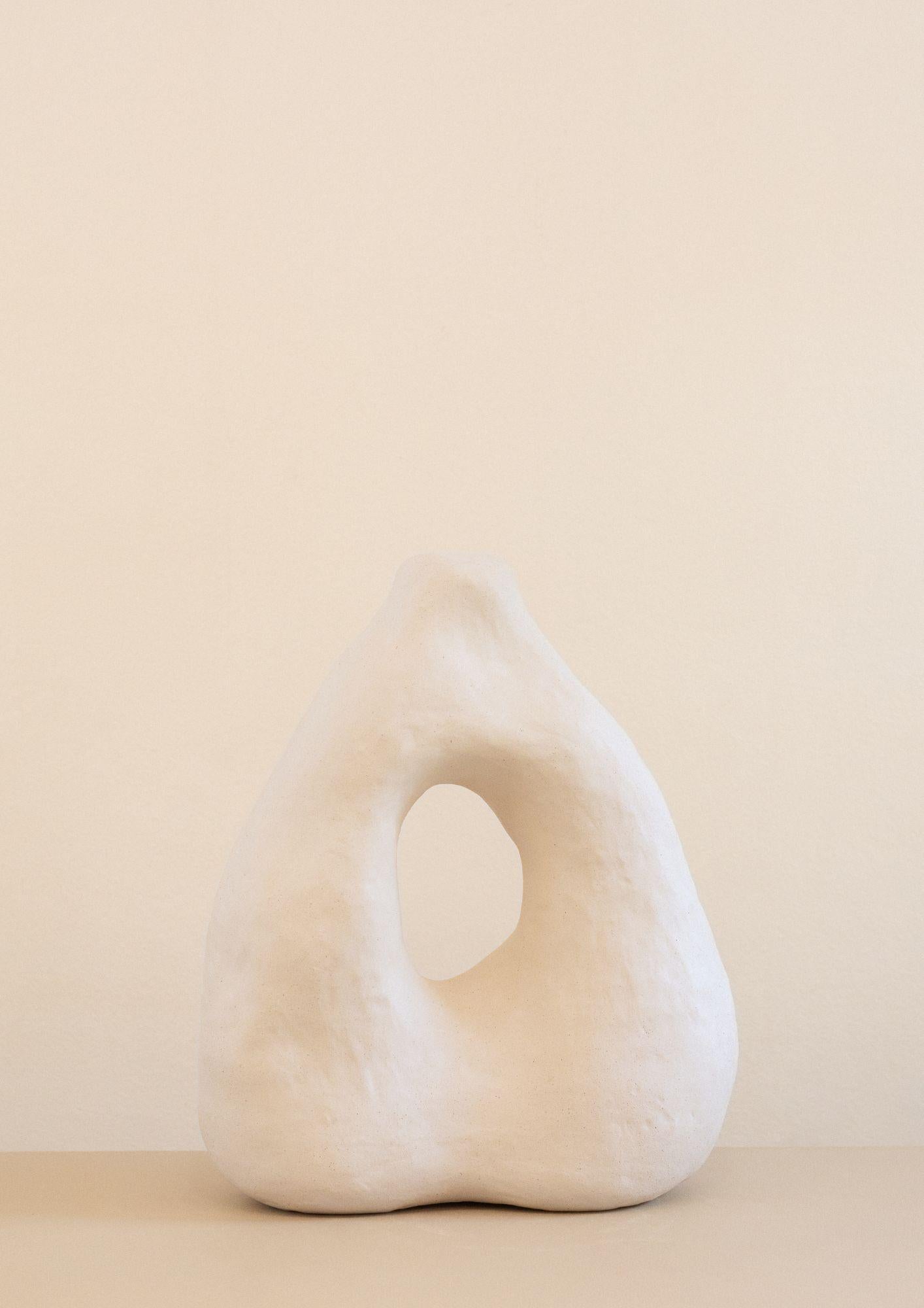 This sculpture is part of the Rupa series, a collection of handcrafted pieces crafted without molds that absorb the contours and textures of the craftsman's hand, transforming it into an object with a clean and complex shape.

The sculpture N.2 are