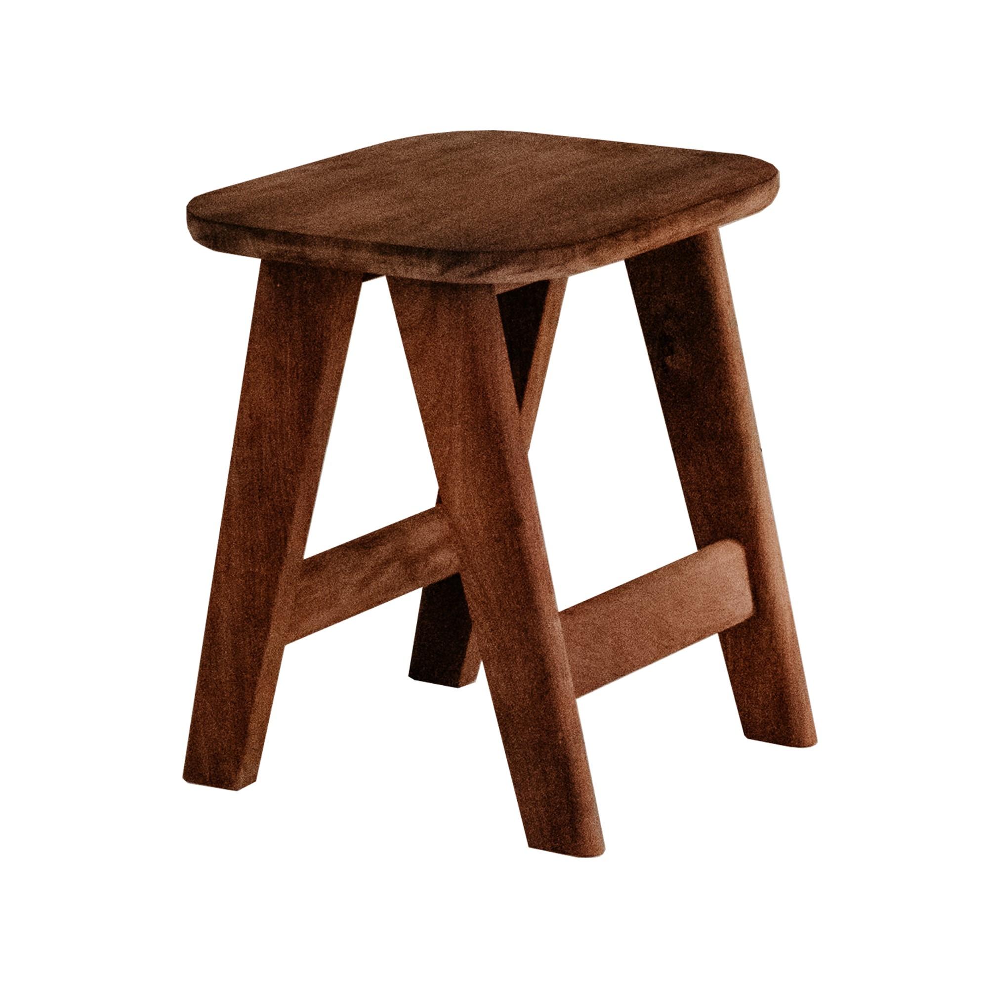 This handcrafted stool made from a richly-grained Iroko was designed and made by Quanström Studio in collaboration with par-avion co. in their shared Norwich, UK workshop. The simple design, with a subtle leg splay base and rounded-edge top gives a