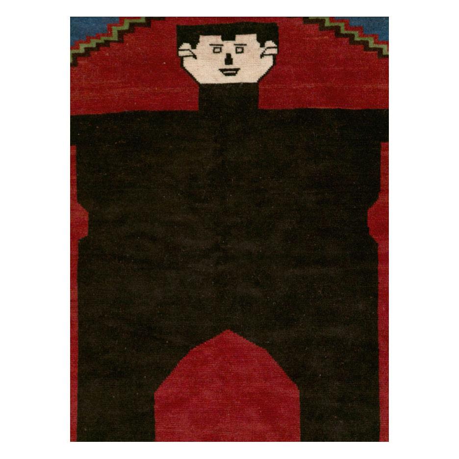 A modern Afghan accent rug handmade during the 21st century with a pictorial depiction of the horror Classic character, Frankenstein.

Measures: 6' 8