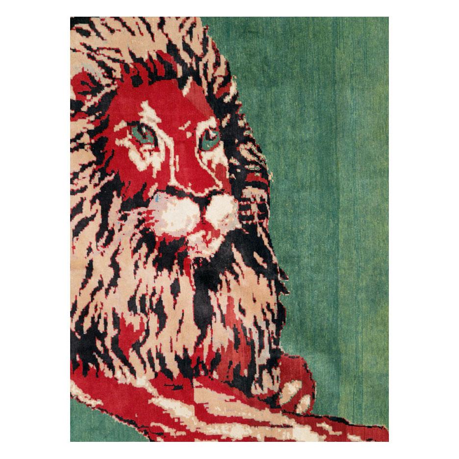 A modern Afghan pictorial room size rug handmade during the 21st century with a lion resting over a green field.

Measures: 8'4