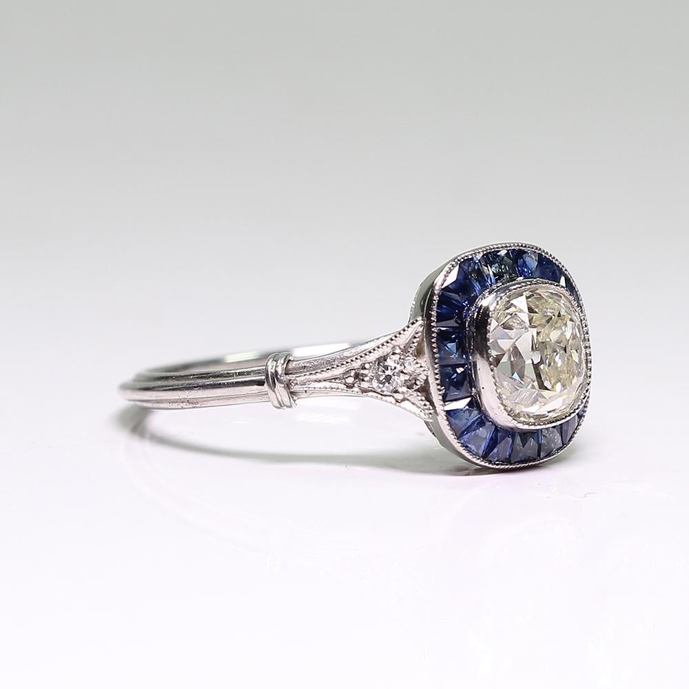 
Composition: Platinum

Stones:

·1 Old mine cut diamond of I-VS2 quality that weigh 1.05ctw.
·2 Old mine cut diamonds of H-VS2 quality that weigh 0.05ctw.
·22 natural calibrated French cut sapphires that weigh 1.10ctw.

This purchase comes with a