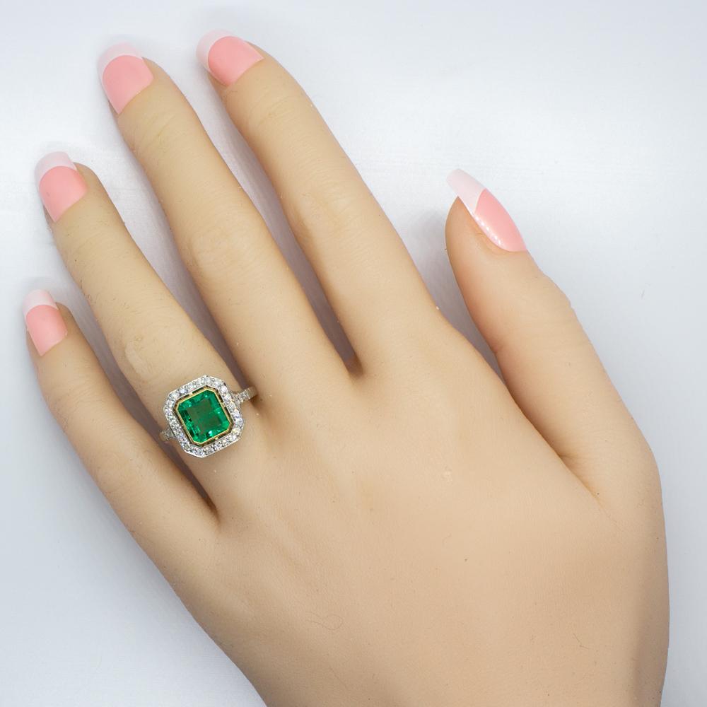 Composition: Platinum
Stones:
•	1 natural Colombian emerald that weighs 1.65ctw.
•	30 Old mine cut diamonds of H-VS2 quality that weigh 0.50ctw. 
Ring size: 7 ½  
Ring face:  12mm by 12mm 
Rise above finger: 5mm.¬
Total weight:  4.6grams –