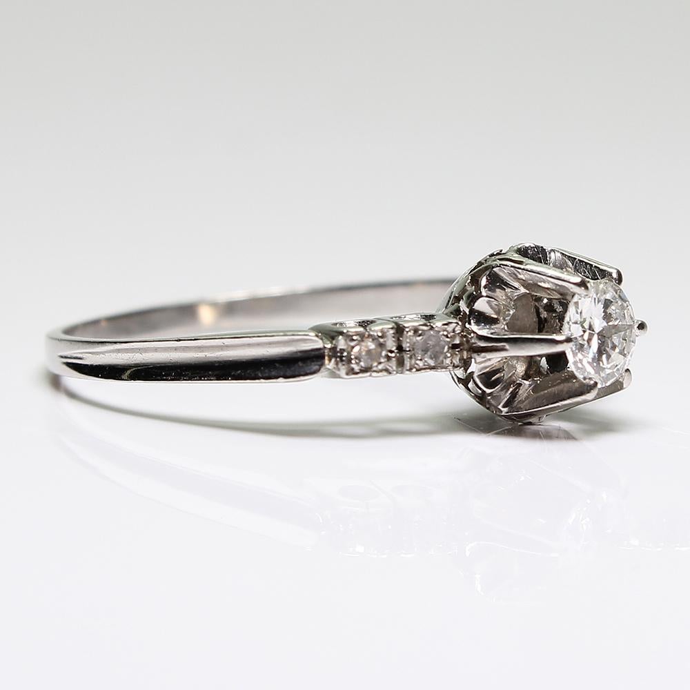 Period: Art Deco (1920-1935)
Composition: Platinum.

Stones:
•	1 Old European cut diamond of G-VS2 quality that weighs 0.35ctw.
•	4 Single cut diamonds of J-SI1 quality that weigh 0.05ctw. 

Ring size: 10 ¼  (Need a re-size? Just ask us)
Ring face: 