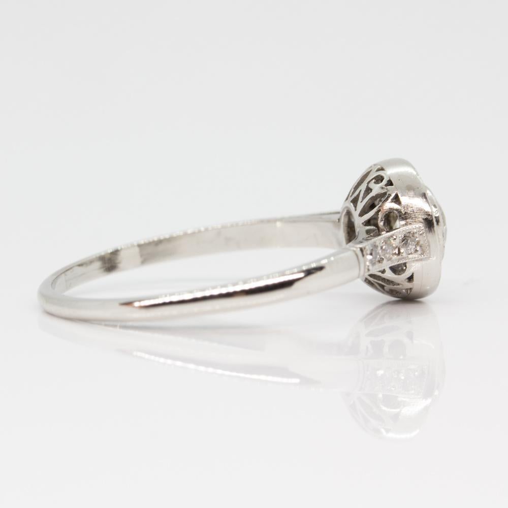 Composition: Platinum
Stones:
•	1 old mine cut diamond H-VS2 0.40ctw approx.
•	15 natural French cut sapphires 0.50ctw
•	6 old mine cut diamonds H-VS2 0.06ctw
Ring size: 7
Ring face:  8mm
Rise above finger: 5mm.¬
Total weight:  2.7 grams – 1.7