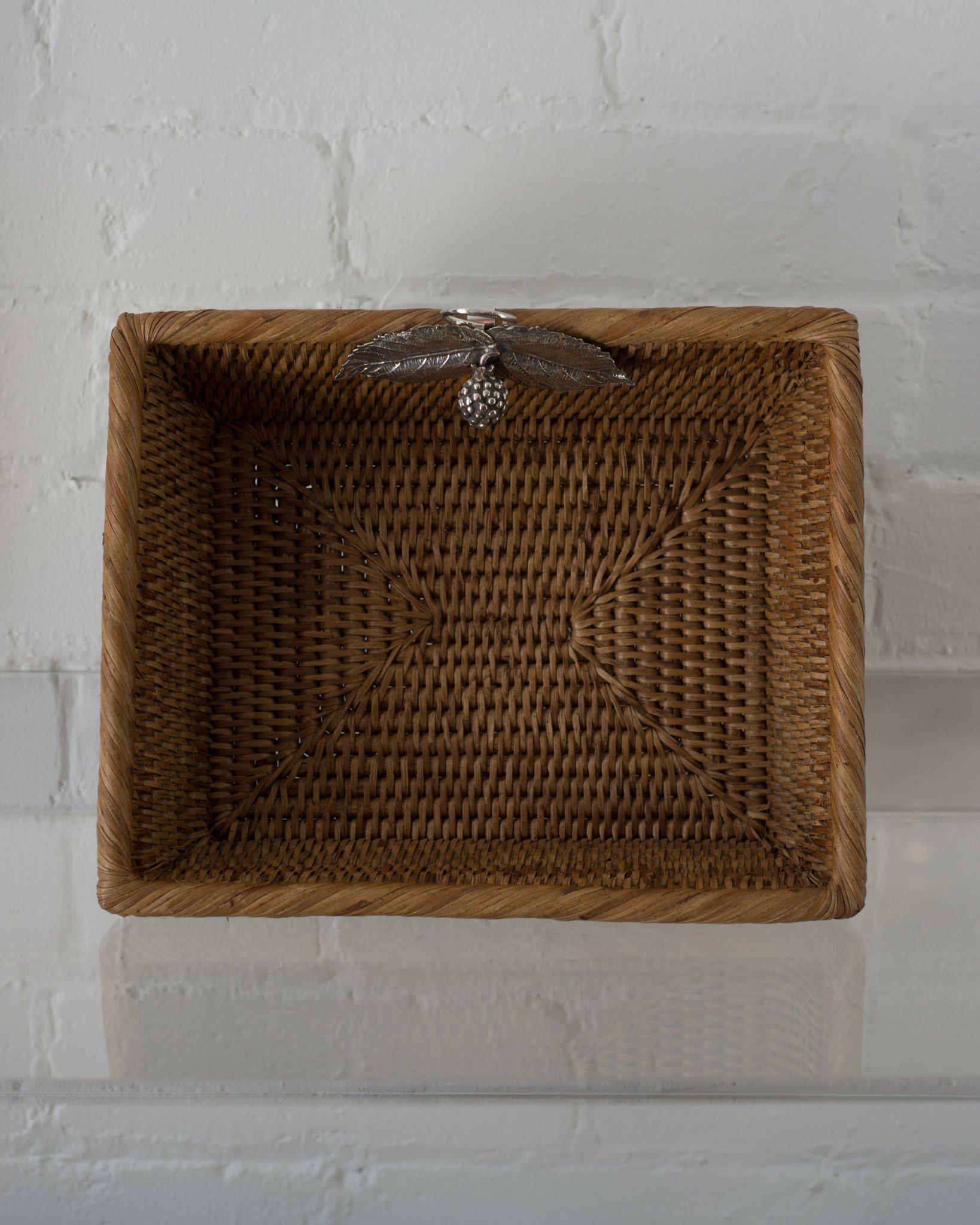 A contemporary rattan rectangular basket with 925 sterling silver leaves and a berry, handmade in Porto.