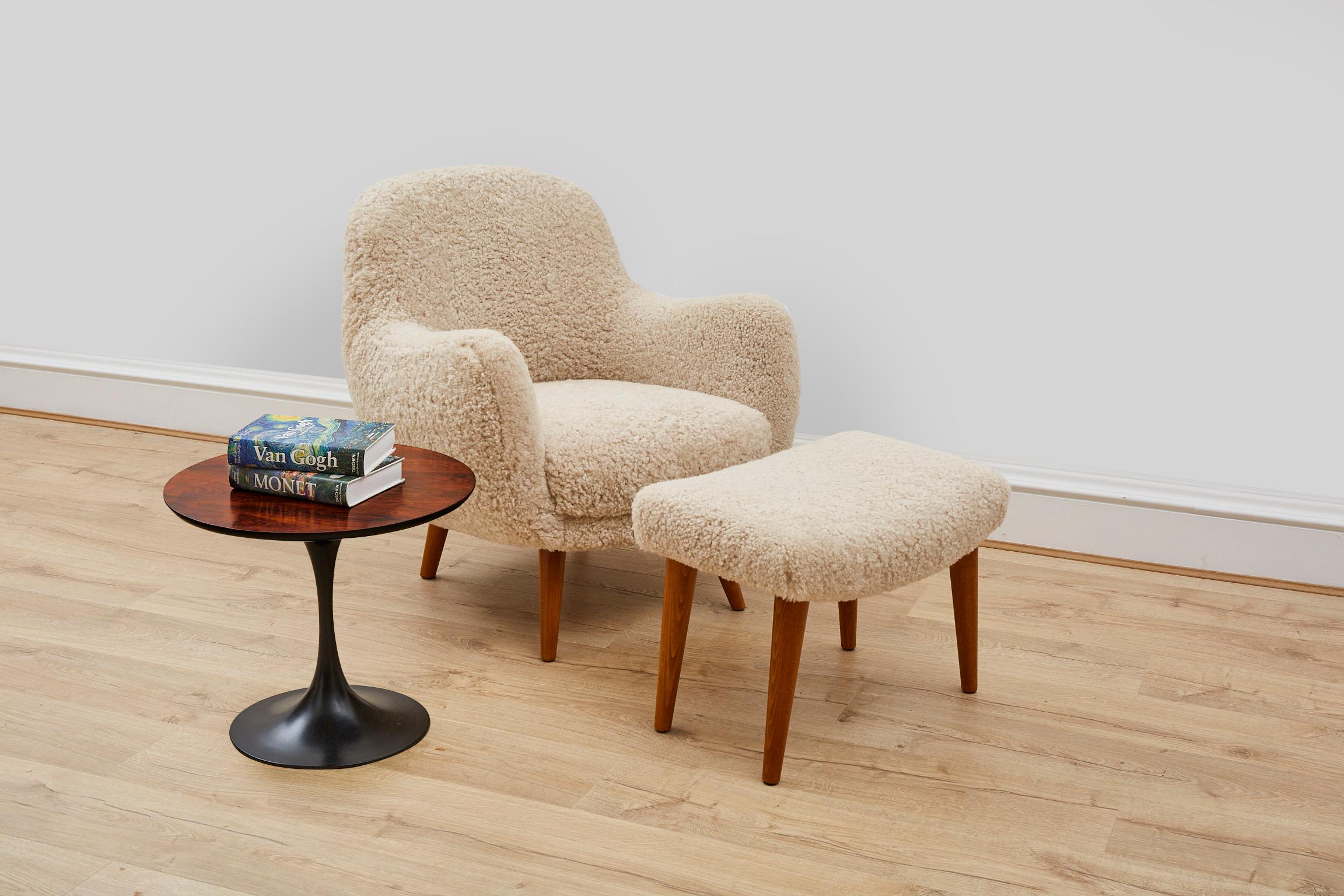 This beautiful contemporary armchair and footstool is handmade exclusively for Antique Modern Mix in the UK, using traditional methods and ethically sourced sheep skin from Scandinavia. 

The frame features a hard wood frame, that has been drilled