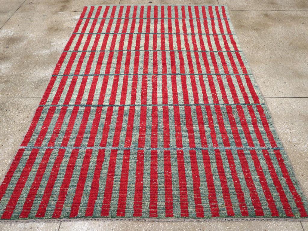 A Turkish Anatolian accent carpet with a contemporary design handmade during the 21st century.

Measures: 6' 7