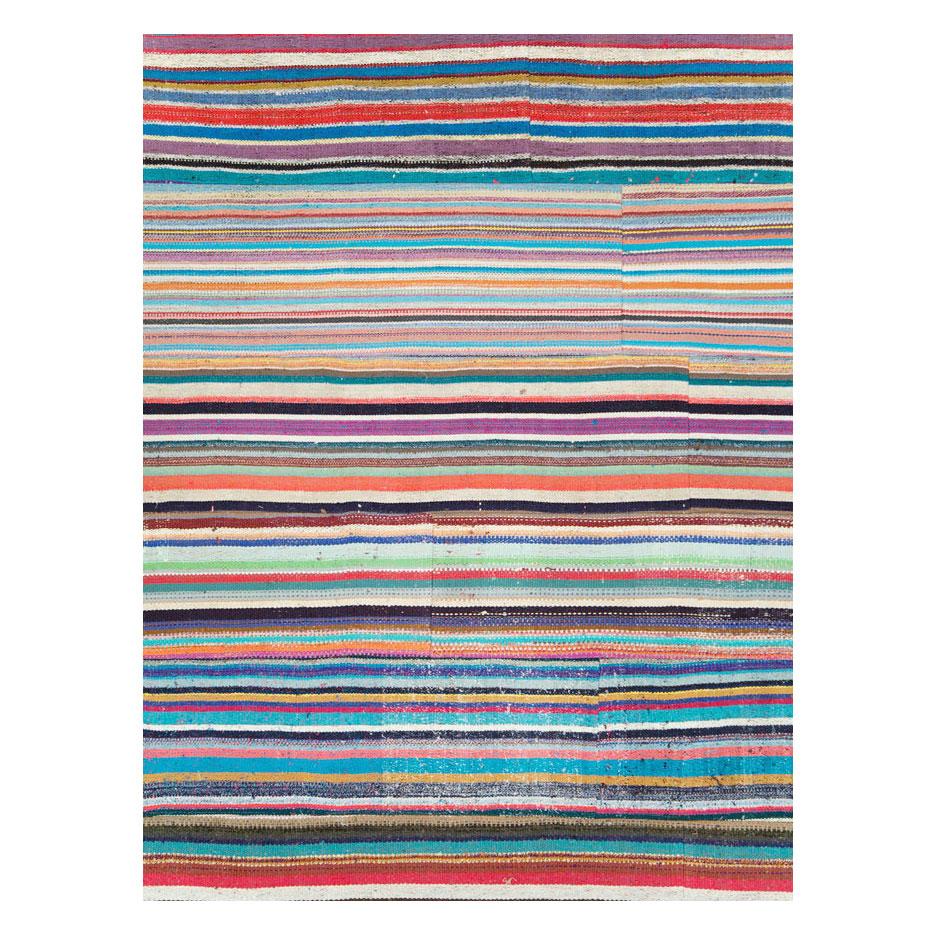 A modern Turkish flat-weave Kilim large room size carpet handmade during the 21st century with a colorful horizontally striped pattern. A statement piece with its bright and whimsical colors.

Measures: 13' 0