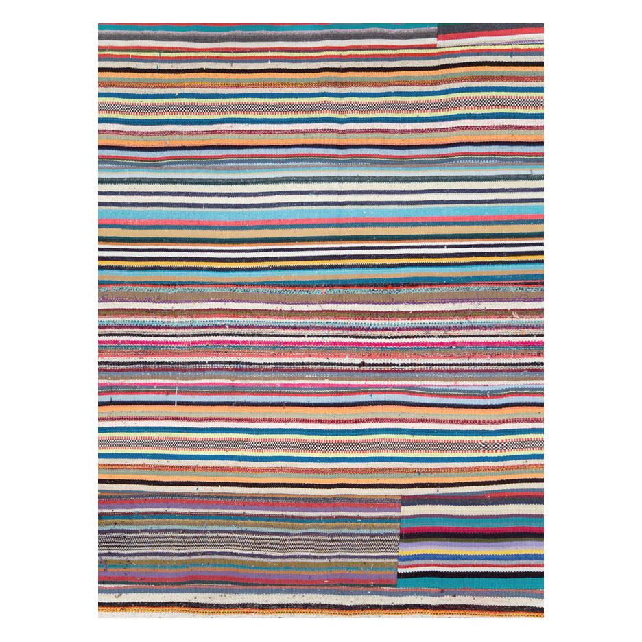 A modern Turkish flat-weave Kilim room size rug handmade during the 21st century with a colorful horizontal pattern. A statement piece with its bright and whimsical colors.

Measures: 10' 0