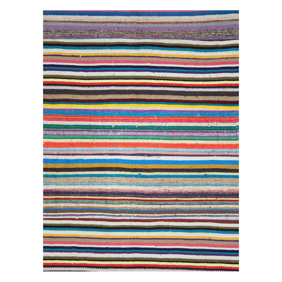 A modern Turkish flat-weave Kilim room size rug handmade during the 21st century with a colorful horizontally striped pattern. A statement piece with its bright and whimsical colors.

Measures: 8' 3