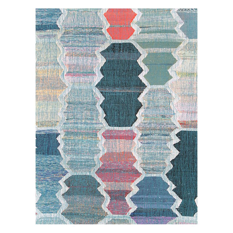 A modern Turkish flat-weave kilim large room size carpet handmade during the 21st century with a colorful geometric abstract pattern with serrated edges.

Measures: 13' 3