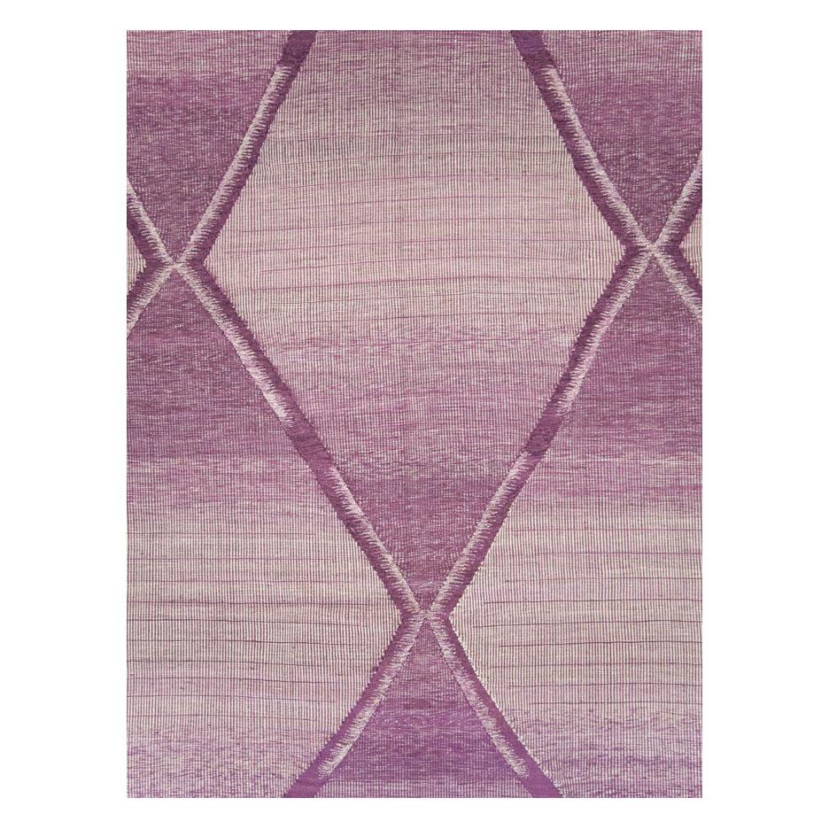 A modern Turkish flatweave Kilim large room size carpet handmade during the 21st century with a contemporary large diamond lattice design in purple and white.

Measures: 10' 2