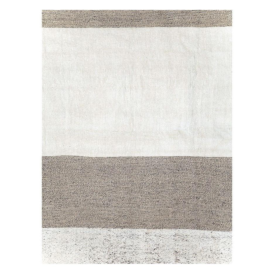 A modern Turkish flatweave Kilim room size carpet handmade during the 21st century with 6 interchanging horizontal bands in white and salt and pepper (white and brown).

Measures: 8' 0