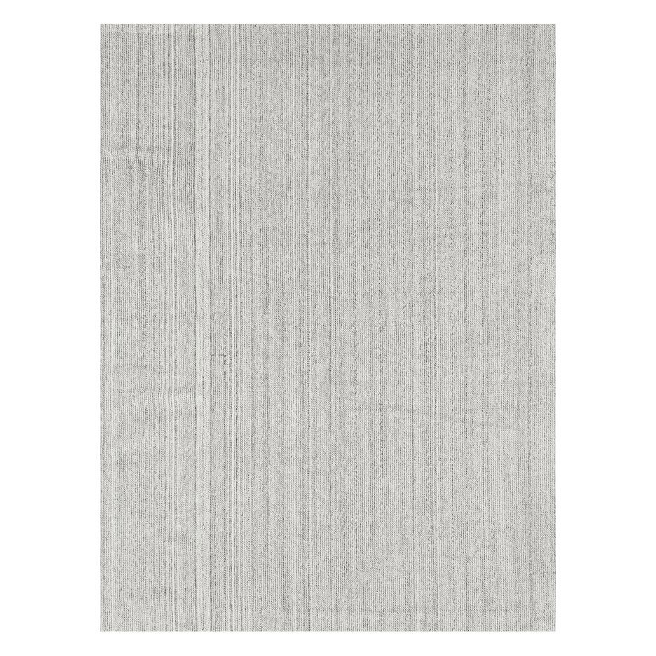 A modern Turkish 14' x 20' flat-weave Kilim rug handmade during the 21st century in white with brown stitching. From afar the rug comes off as almost grey. The neutral colors make it very easy to incorporate into your design scheme.

Measures: 13'