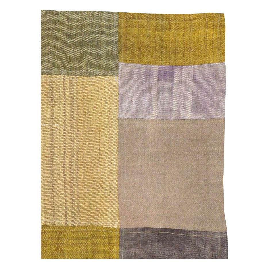 A modern Turkish Patchwork style flatweave throw rug handmade during the 21st century using remnants of vintage Turkish flatweaves from the mid-20th century.

Measures: 3' 1