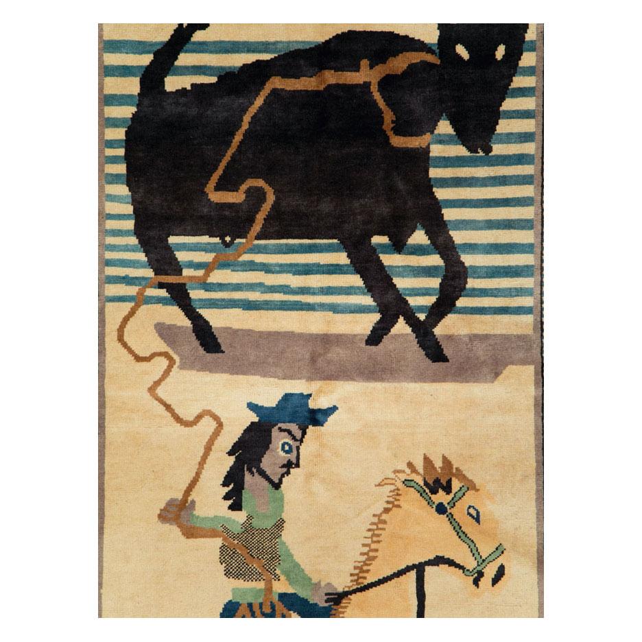 A modern Turkish accent rug handmade during the 21st century with a pictorial design of a steer roping cowboy.

Measures: 5' 1