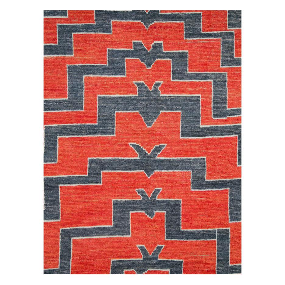 A modern Turkish Tulu large room size rug with a low shaggy pile handmade during the 21st century. The geometric 