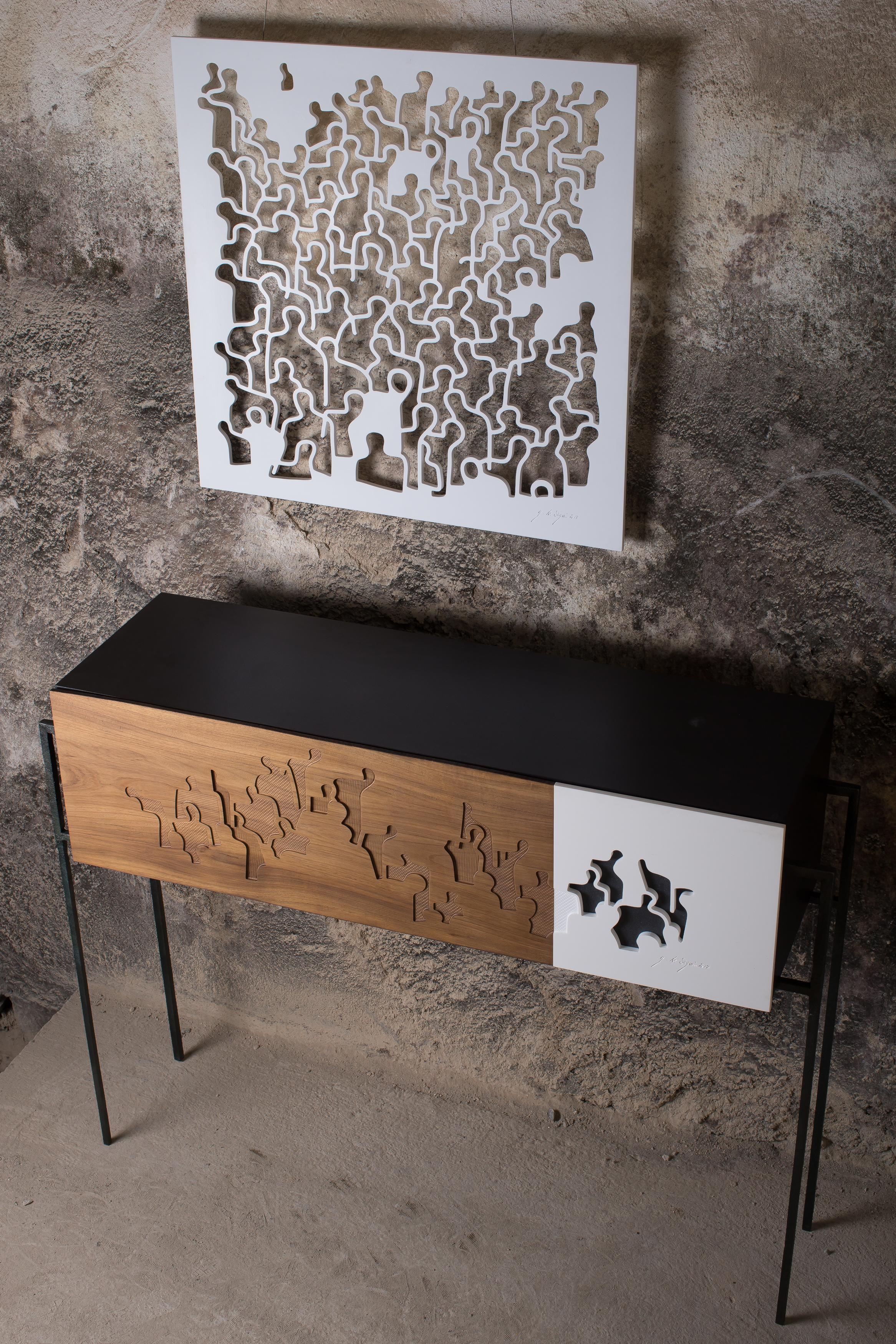 This is a beatuiful sideboard with interior shelves handmade and designed in France by Eric Blanc. The front is covered with a unique artwork by artist Gaetan de Seguin. It is a captivating piece of furniture, elegant and minimalistic in its design.