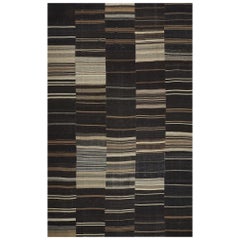 Tappeto contemporaneo in lana intrecciata a mano